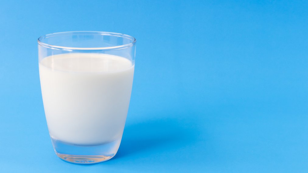 Close-Up Of Milk Against Blue Background